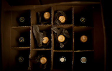 A birds-eye view of a box of wine bottles, carefully wrapped, transported and stored with Domaine PickUp.